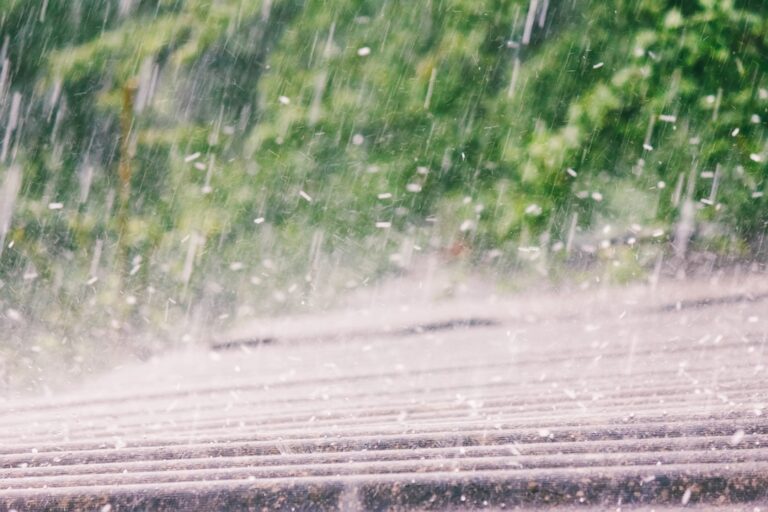 rain with hail falls on the roof of slate